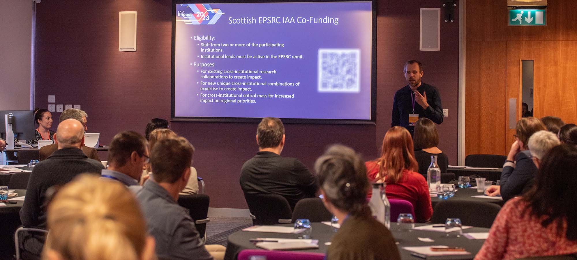 Hjalmar Eriksson presenting the cross-institutional EPSRC IAA funding call at the IAA Impact Festival 2023.